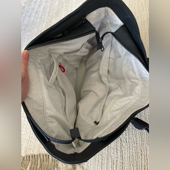 Lululemon gym bag. EUC. Loads of pockets. Very sturdy construction. - Picture 9 of 9